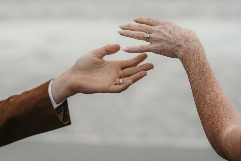 Two hands almost touchhing.